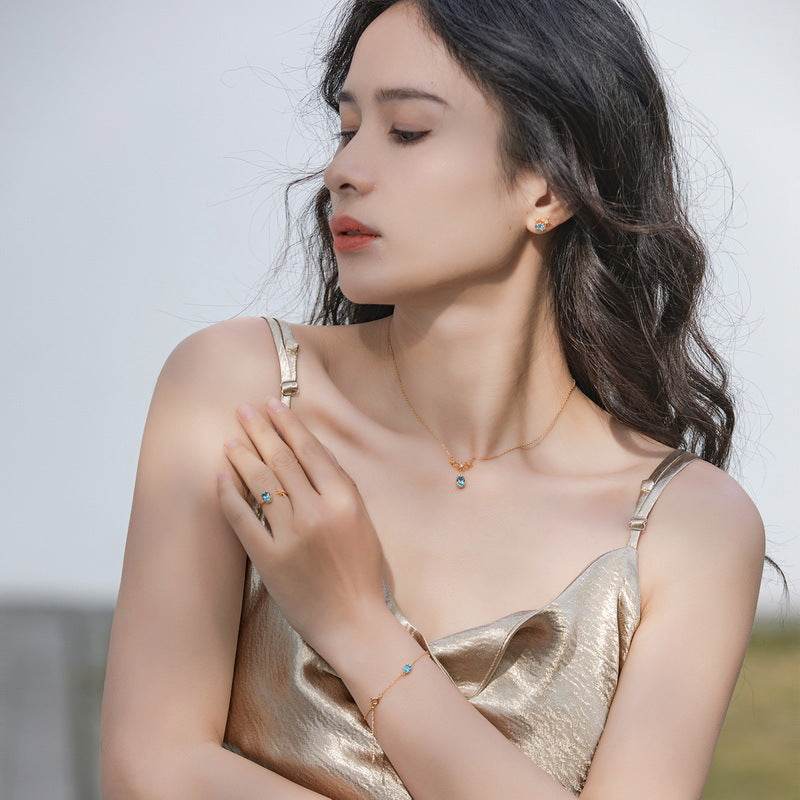 Handcrafted Star Earrings Genuine Swiss Blue Topaz in Gold-Accented Sterling Silver - MOWTE