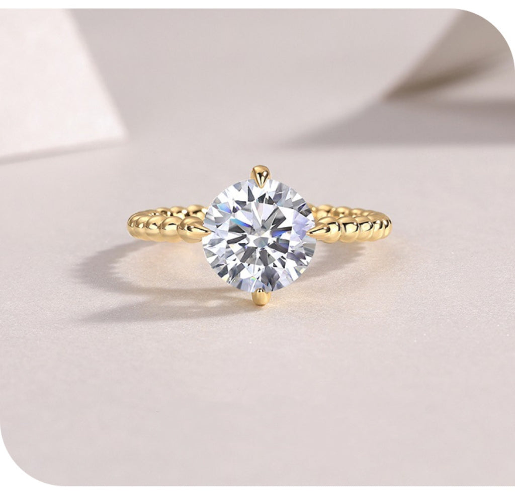 Gold-toned style 925 silver four-prong ring with moissanite comes with certificate